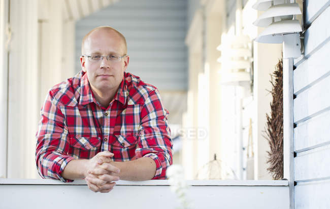 Portrait of man standing in porch, selective focus — Stock Photo