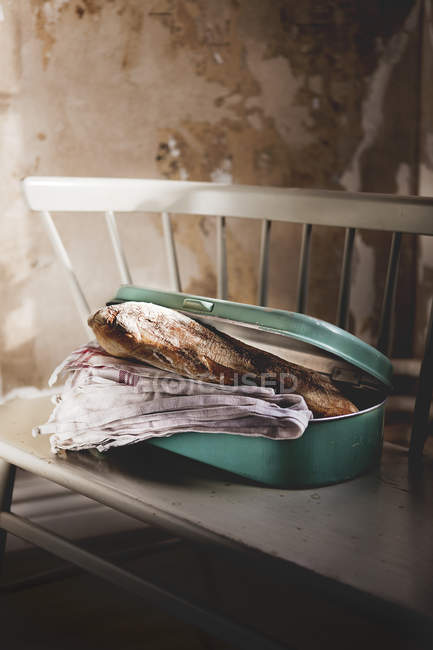 Front view of homemade bread in metal container — Stock Photo