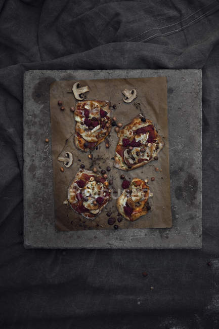 Top view of cooked pizza on cutting board — Stock Photo