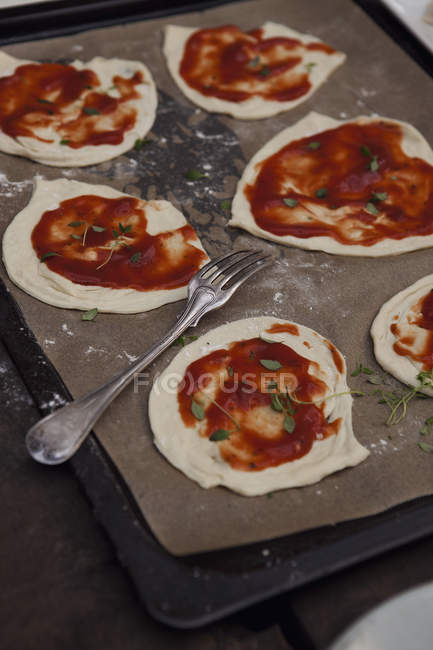 Front view of variation of pizzas preparation — Stock Photo