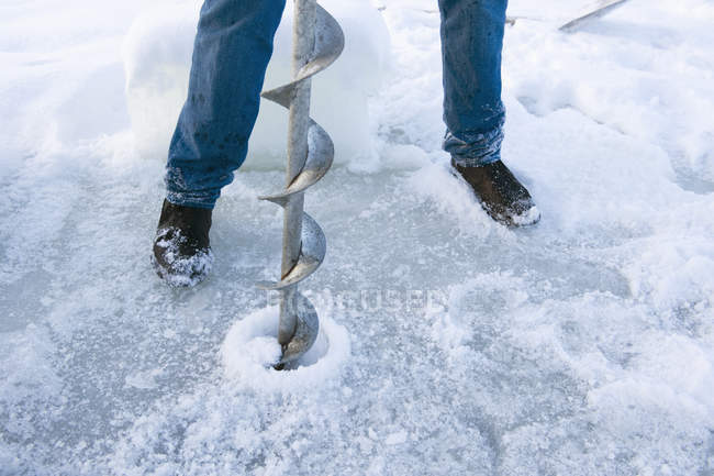 Close-up of ice auger, low section — Stock Photo