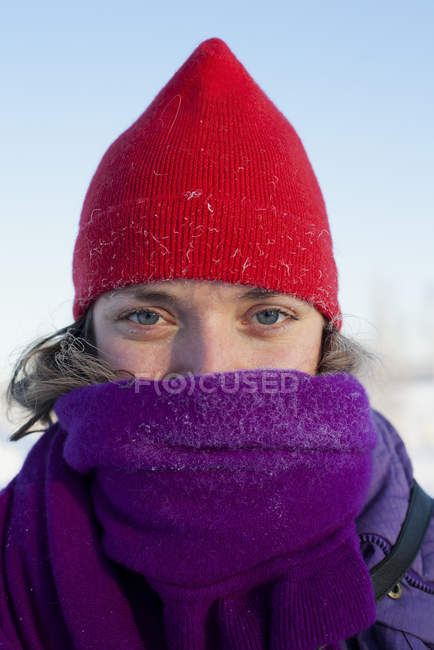 Portrait of woman wearing knit hat and scarf — Stock Photo