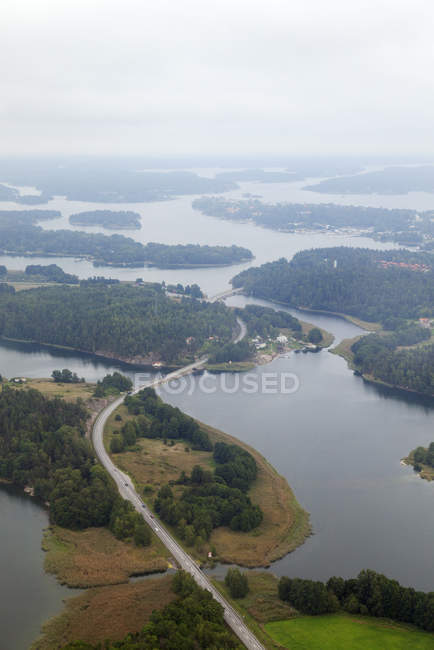 Road winding through islands and water — Stock Photo