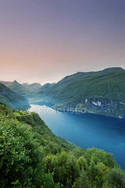 Scenic view of green hills and fjord water — Stock Photo