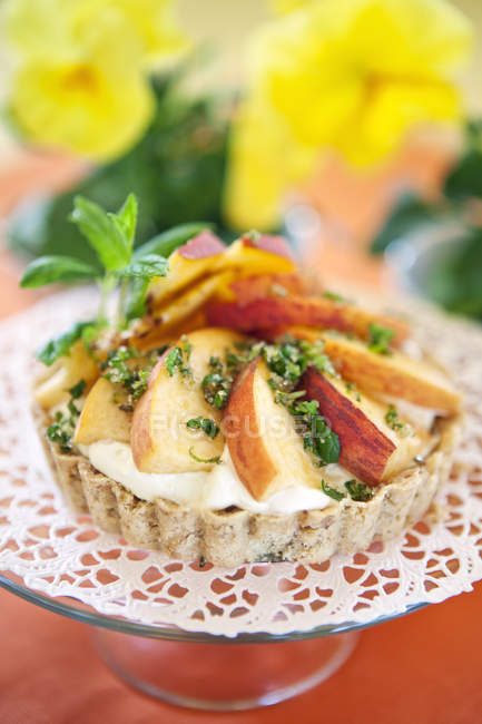 Nectarine tart with vanilla cream on cakestand — Stock Photo