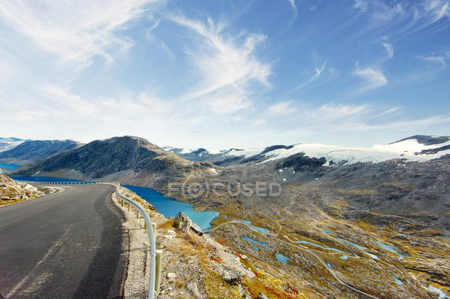 Scenic view of fjord and mountains from road — Stock Photo