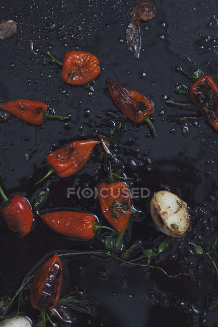 Top view of red chili peppers on frying pan — Stock Photo