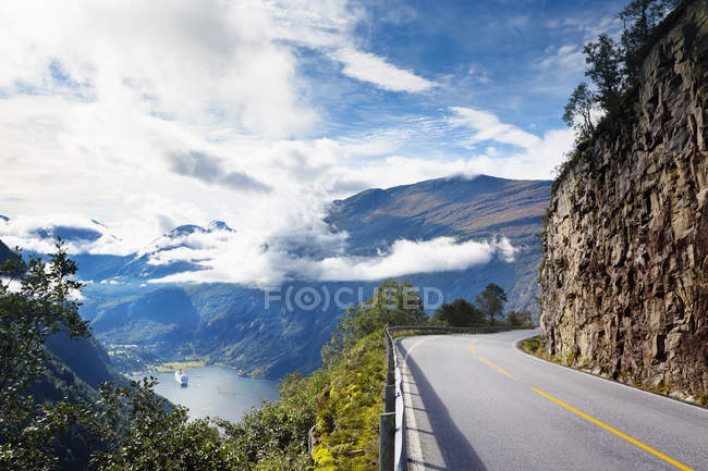 Scenic view of river and mountains from road — Stock Photo