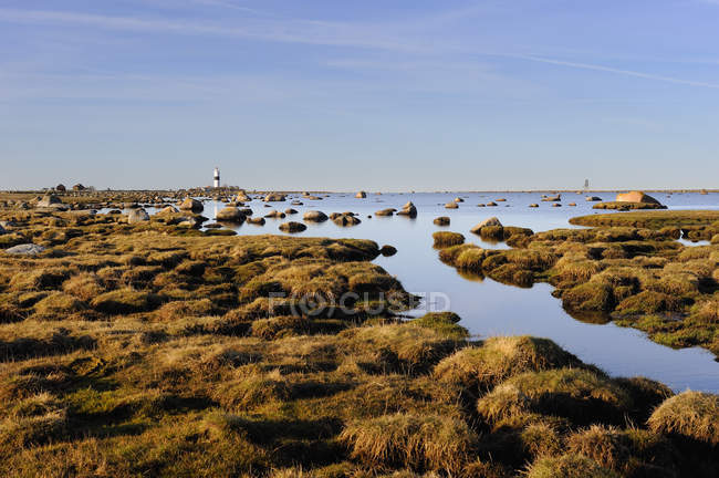 Flooded landscape with lighthouse in background — Stock Photo