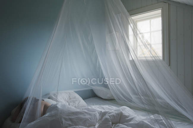 Woman lying in bed, selective focus — Stock Photo
