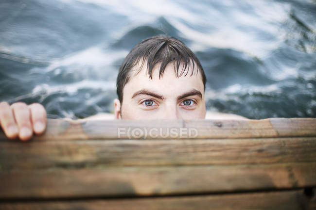 High angle view of man under jetty, selective focus — Stock Photo