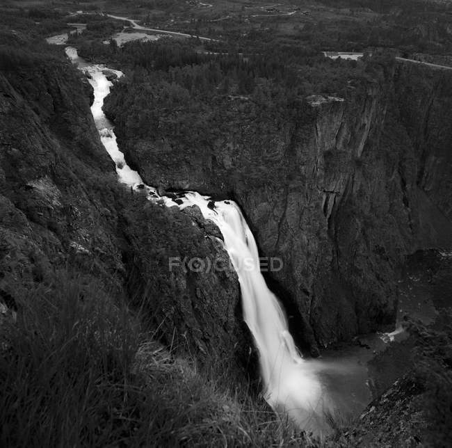 Scenic view of waterfall, black and white — Stock Photo