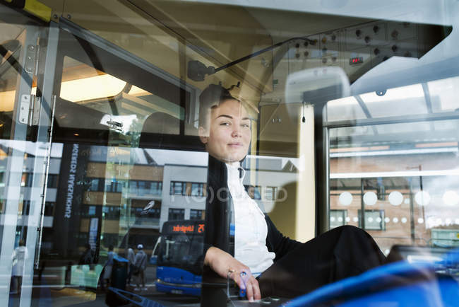 Female tram driver seen through window — Stock Photo