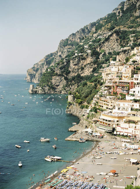 Townscape with boats in harbor and Tyrrhenian sea — Stock Photo