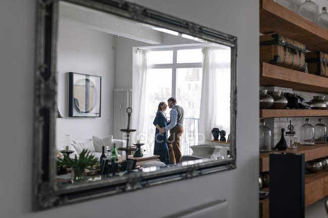 Couple reflected in mirror, selective focus — Stock Photo