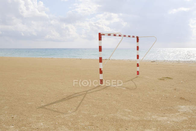 Beach soccer goal with sea in background — Stock Photo