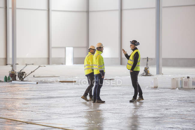 Three engineers at work, selective focus — Stock Photo