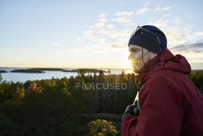 Looking at view of man looking at view, focus on foreground — Stock Photo