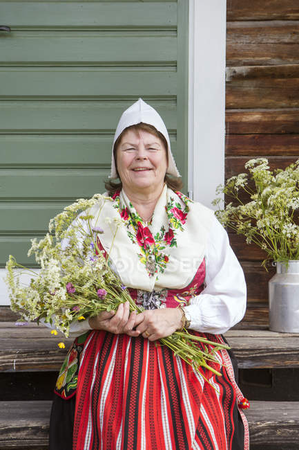 Portrait of senior woman in traditional clothing — Stock Photo
