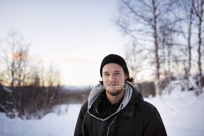 Portrait of young man wearing parka in winter — Stock Photo