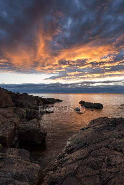 Rocks by sea at sunset, Vasterbotten County — Stock Photo