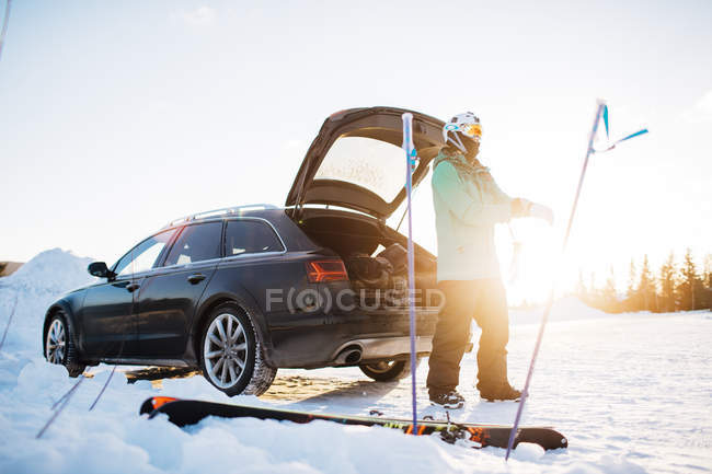 Man by car with skiing equipment, selective focus — Stock Photo