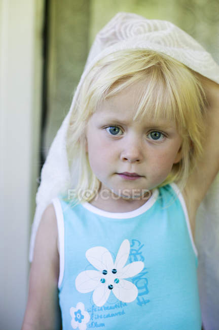 Portrait of girl holding curtain, selective focus — Stock Photo