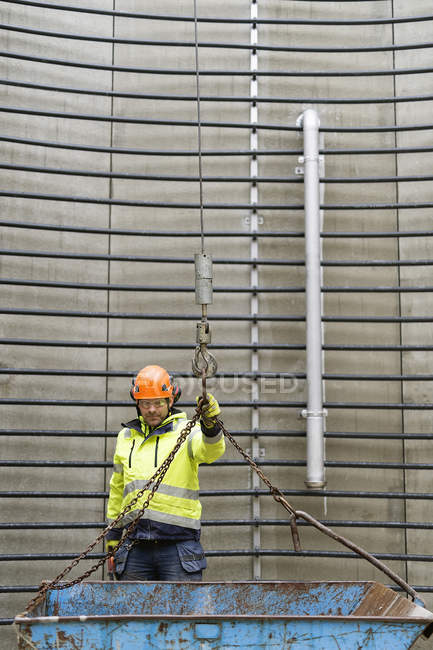 Construction worker standing inside water tower — Stock Photo