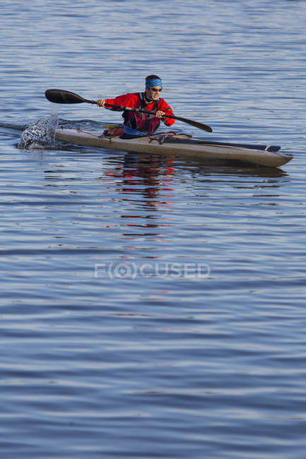 Mature man kayaking in Baltic Sea, selective focus — Stock Photo