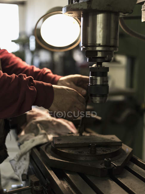 Cropped view of man polishing wood, selective focus — Stock Photo
