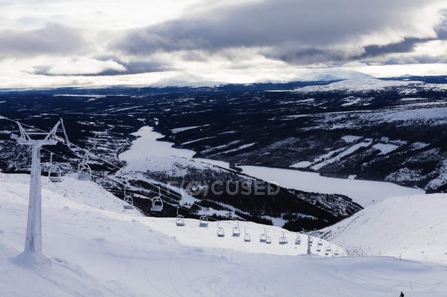 Scenic view of ski lift at mountains at winter — Stock Photo
