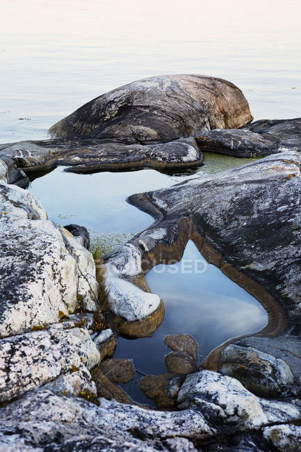 Rock formations by water, stockholm archipelago — Stock Photo