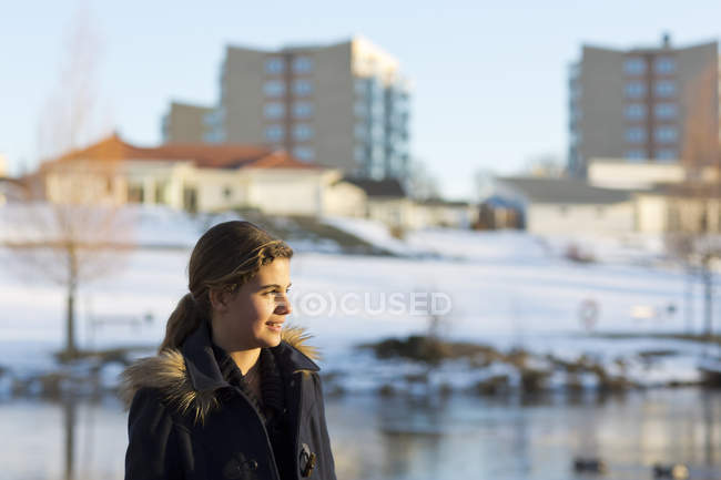 Portrait of smiling teenage girl, focus on foreground — Stock Photo