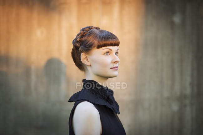 Portrait of young woman, focus on foreground — Stock Photo