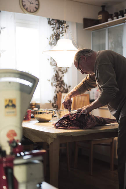 Butcher preparing venison meat, selective focus — Stock Photo