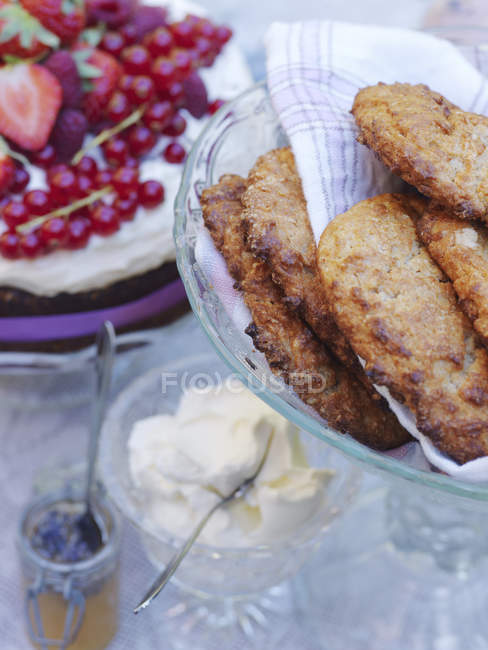 Deep fried sweet cakes on cake stand — Stock Photo