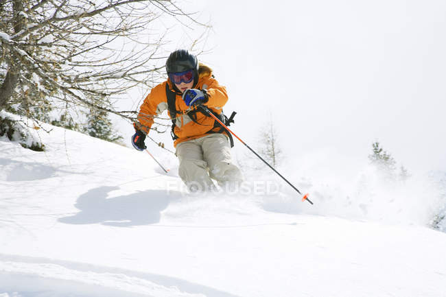 Teenage boy in protective clothing skiing — Stock Photo