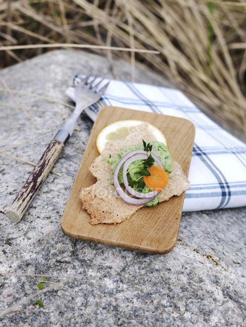 Traditional swedish crispbread on cutting board — Stock Photo