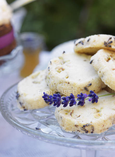 Lavender cookies on cake stand, selective focus — Stock Photo