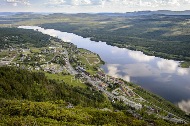 High angle view of river and town in mountains — Stock Photo