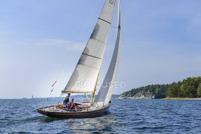 Two men on sailboat, selective focus — Stock Photo