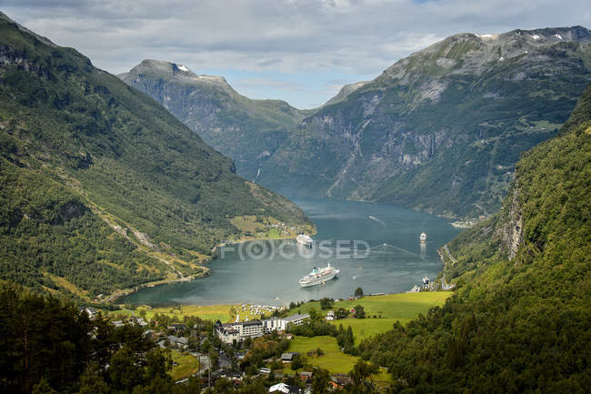 Ship at lake, town in mountains at Sunnmore — Stock Photo
