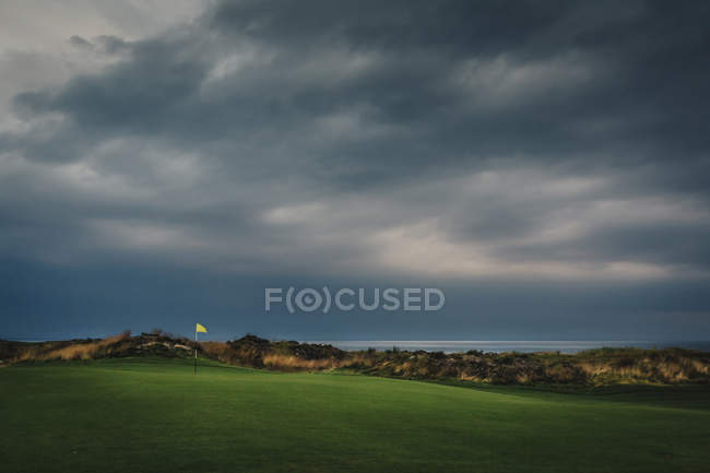 Stormy clouds over golf course, northern europe — Stock Photo