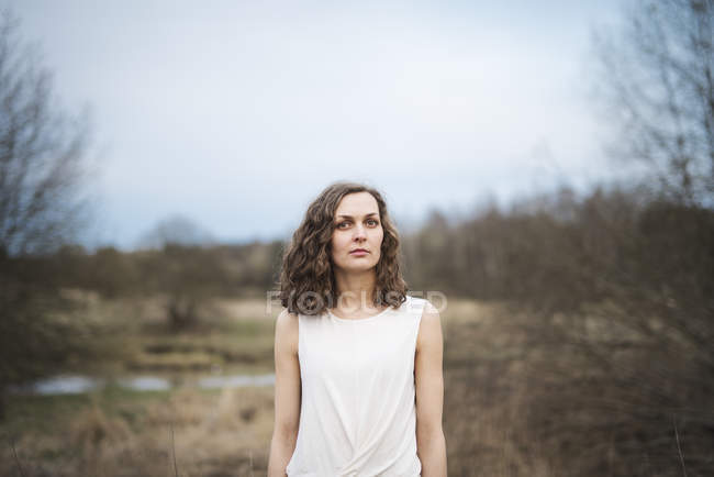 Portrait of young woman, focus on foreground — Stock Photo
