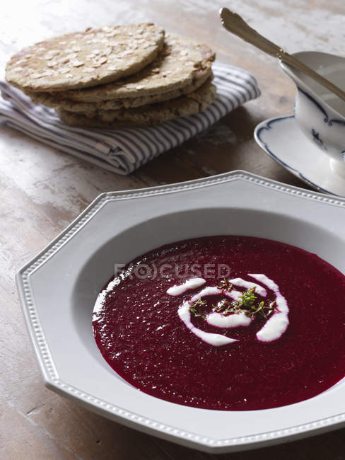 Borscht with sour cream, focus on foreground — Stock Photo