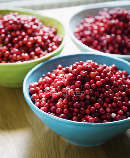 Close-up of bowls with cranberries, focus on foreground — Stock Photo
