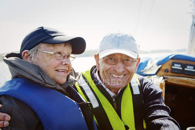 Senior couple in boat, focus on foreground — Stock Photo