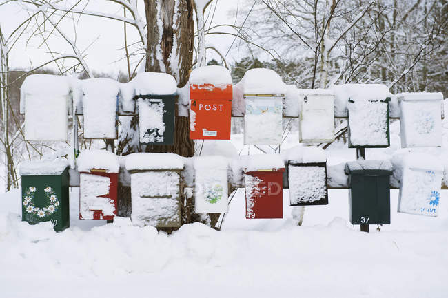 View of mailboxes covered with snow, Dalaro — Stock Photo