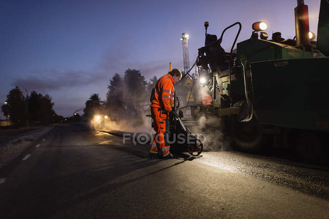 Manual workers repairing road, selective focus — Stock Photo