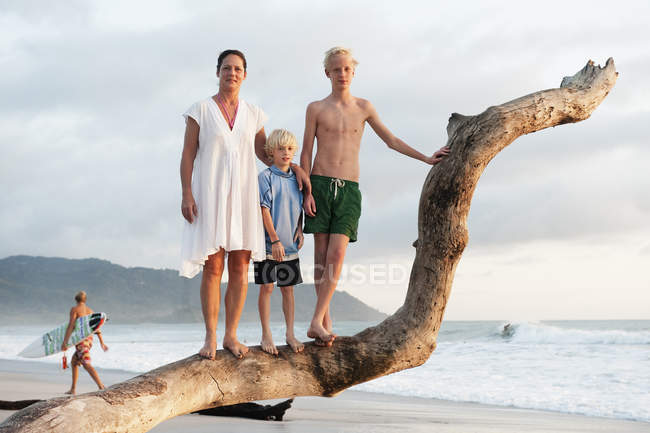 Mother with two sons on beach — Stock Photo